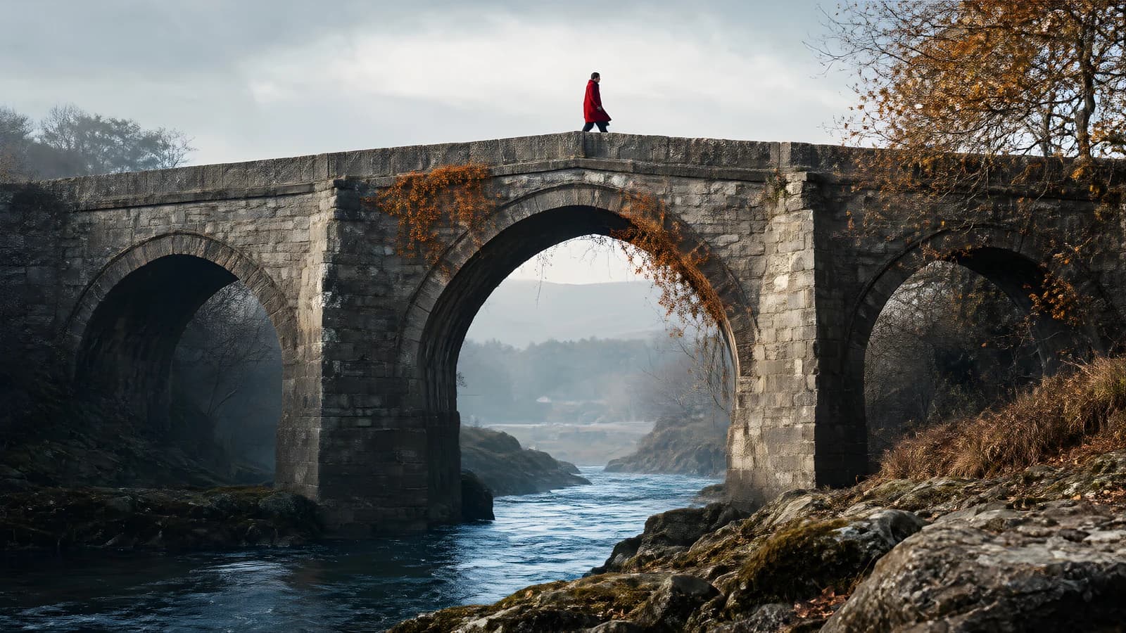 Lone Figure on Stone Bridge