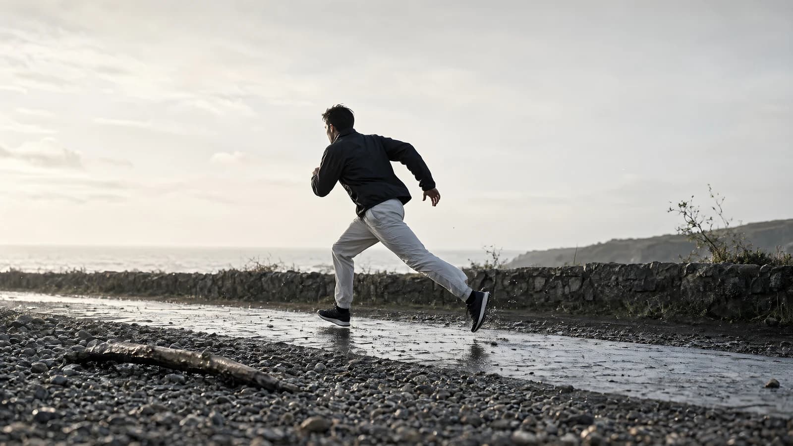 Runner on a Wet Pebble Path